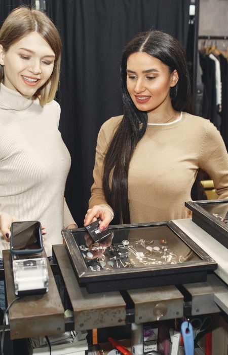 Women paying for clothes with smartphone